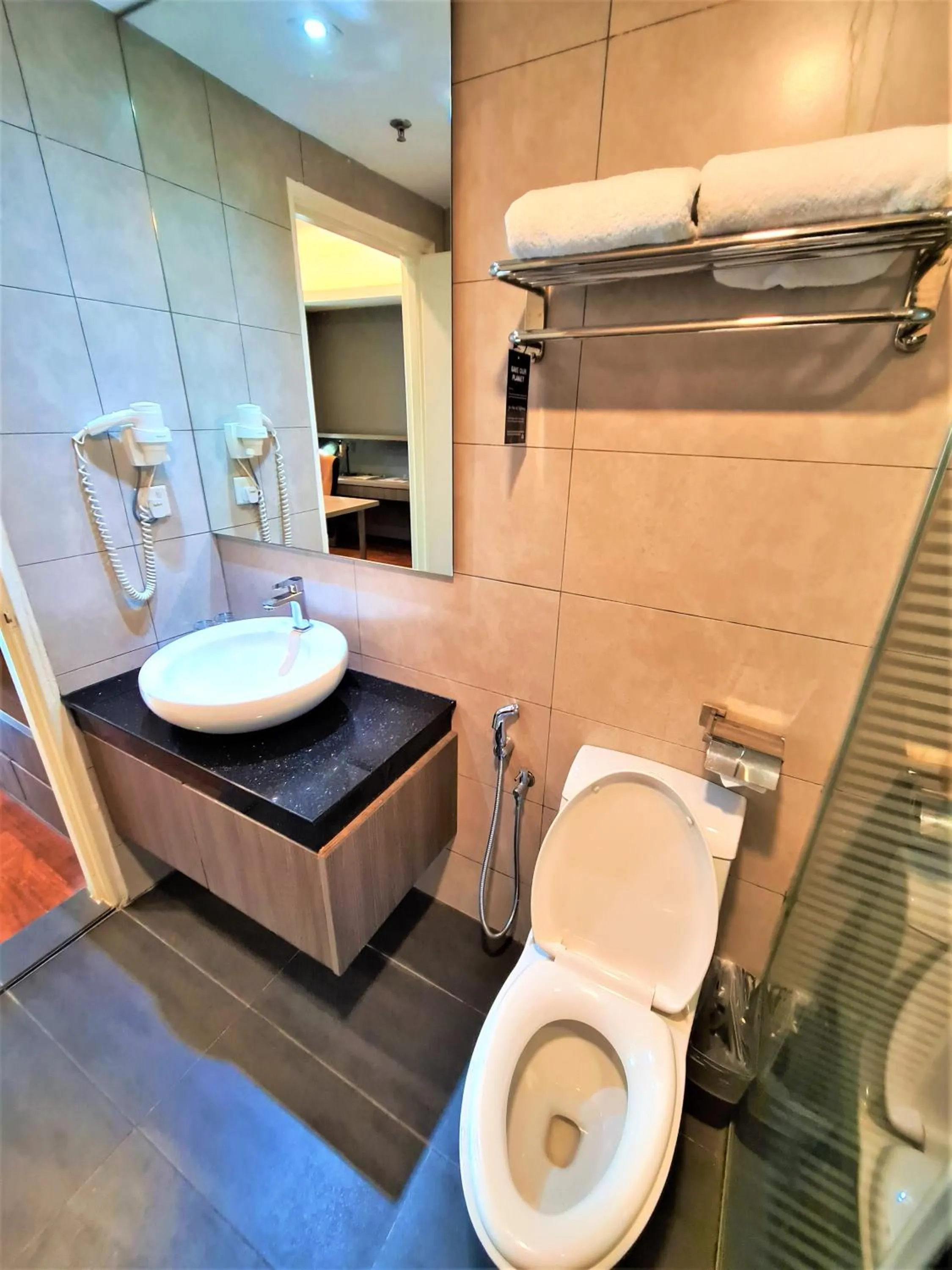 Toilet in Nexus Business Suite Hotel