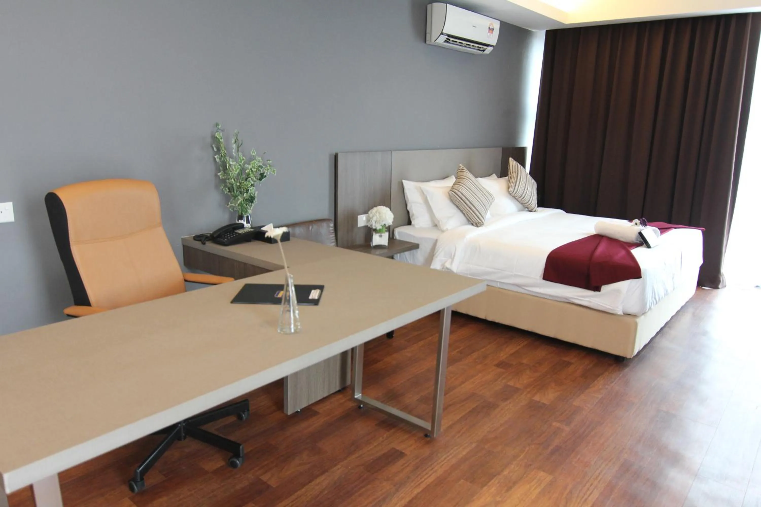Bed in Nexus Business Suite Hotel