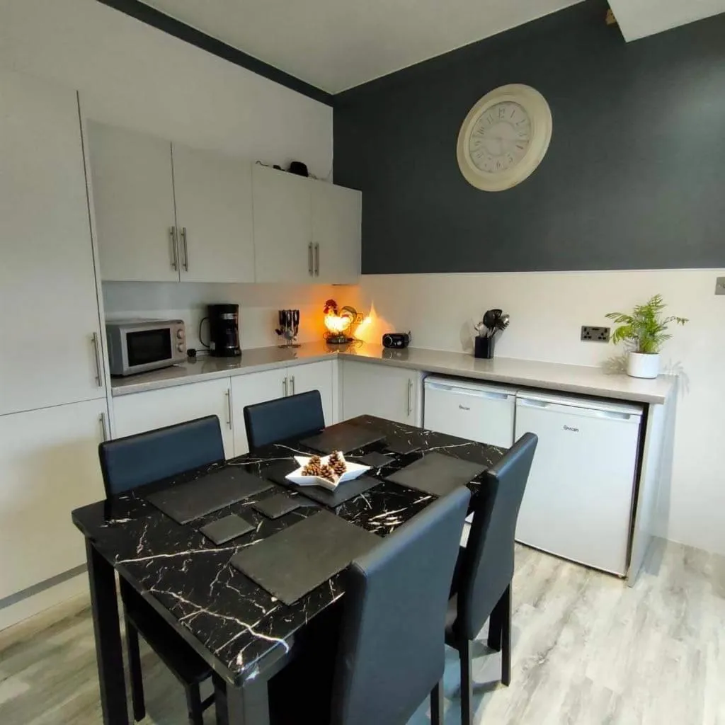 Kitchen or kitchenette in The Old Smiddy Cottage and Apartment