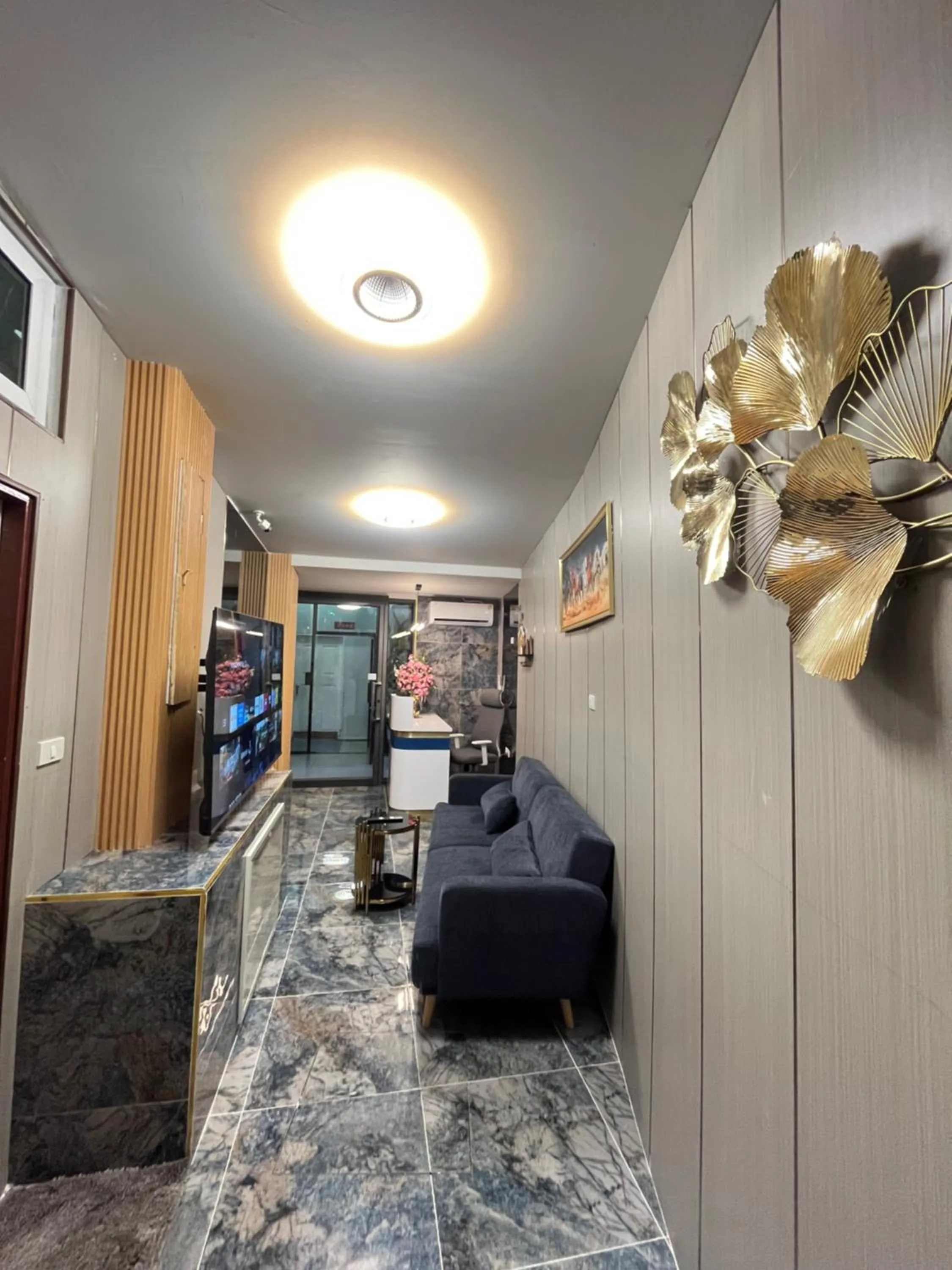Communal lounge/ TV room in Ali House Patong