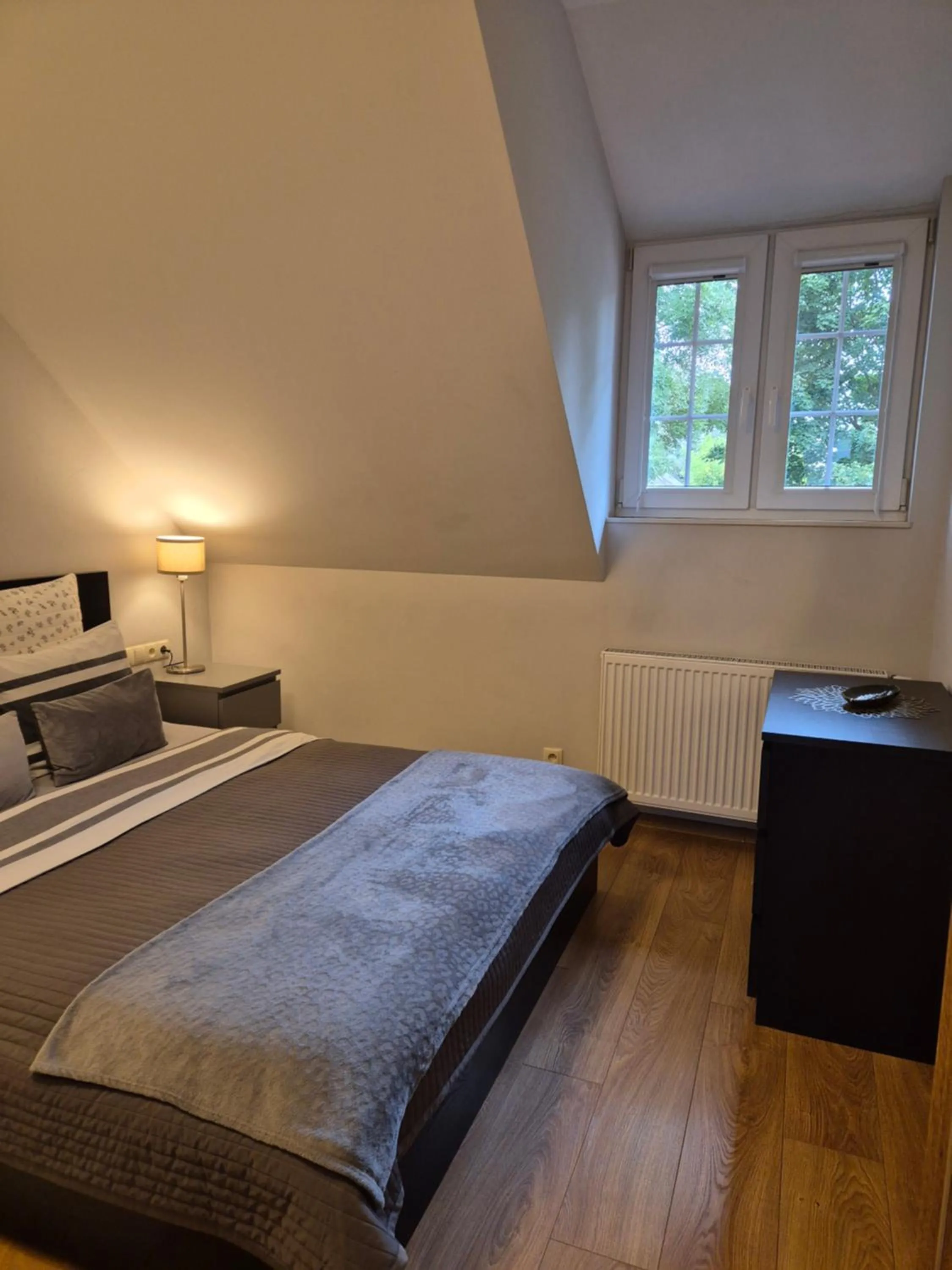 Bed in APARTAMENTY TUŹNIKOWIE