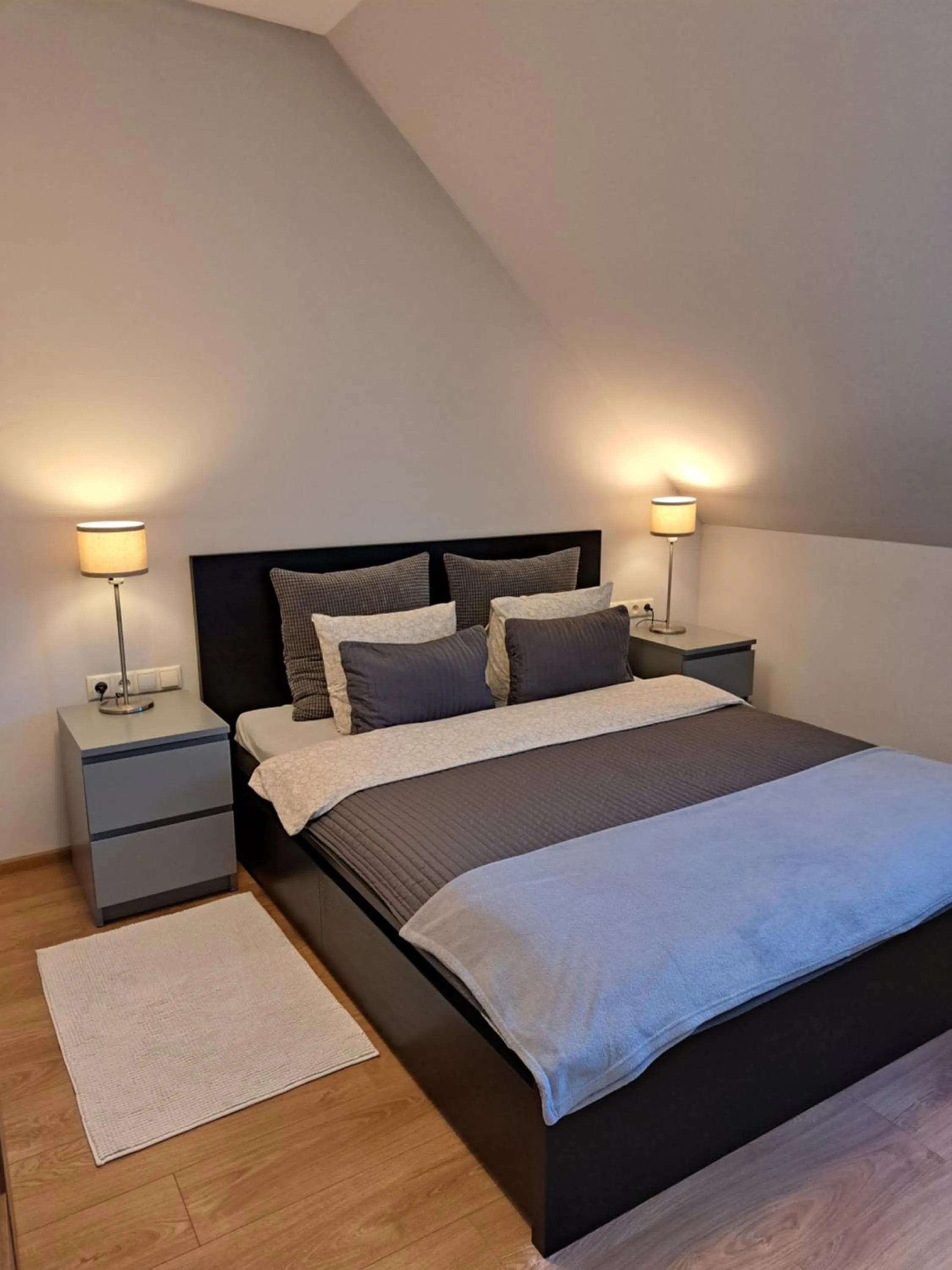 Bed in APARTAMENTY TUŹNIKOWIE