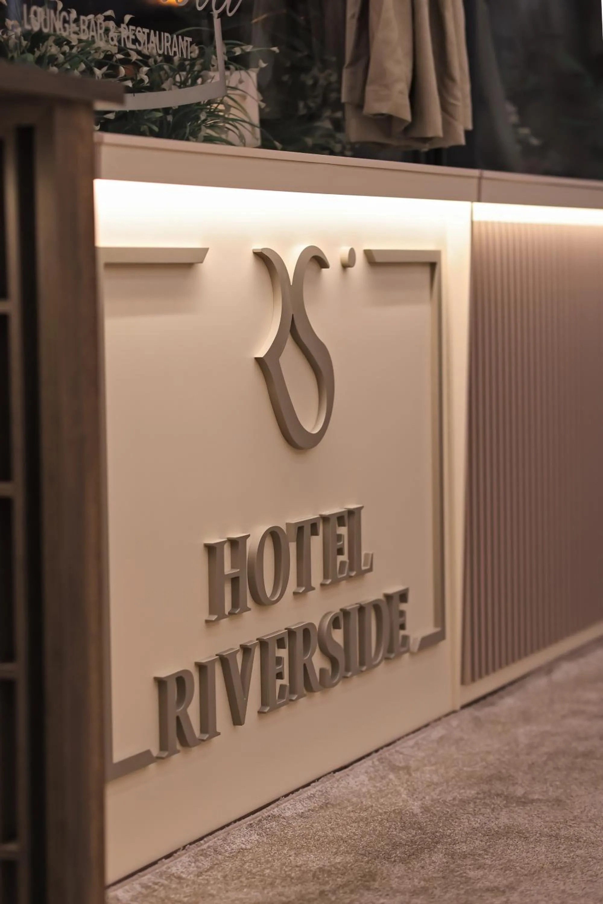 Property logo or sign in Hotel Riverside