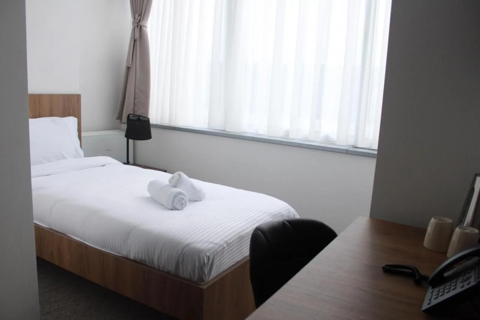Bed in Hotel Riverside