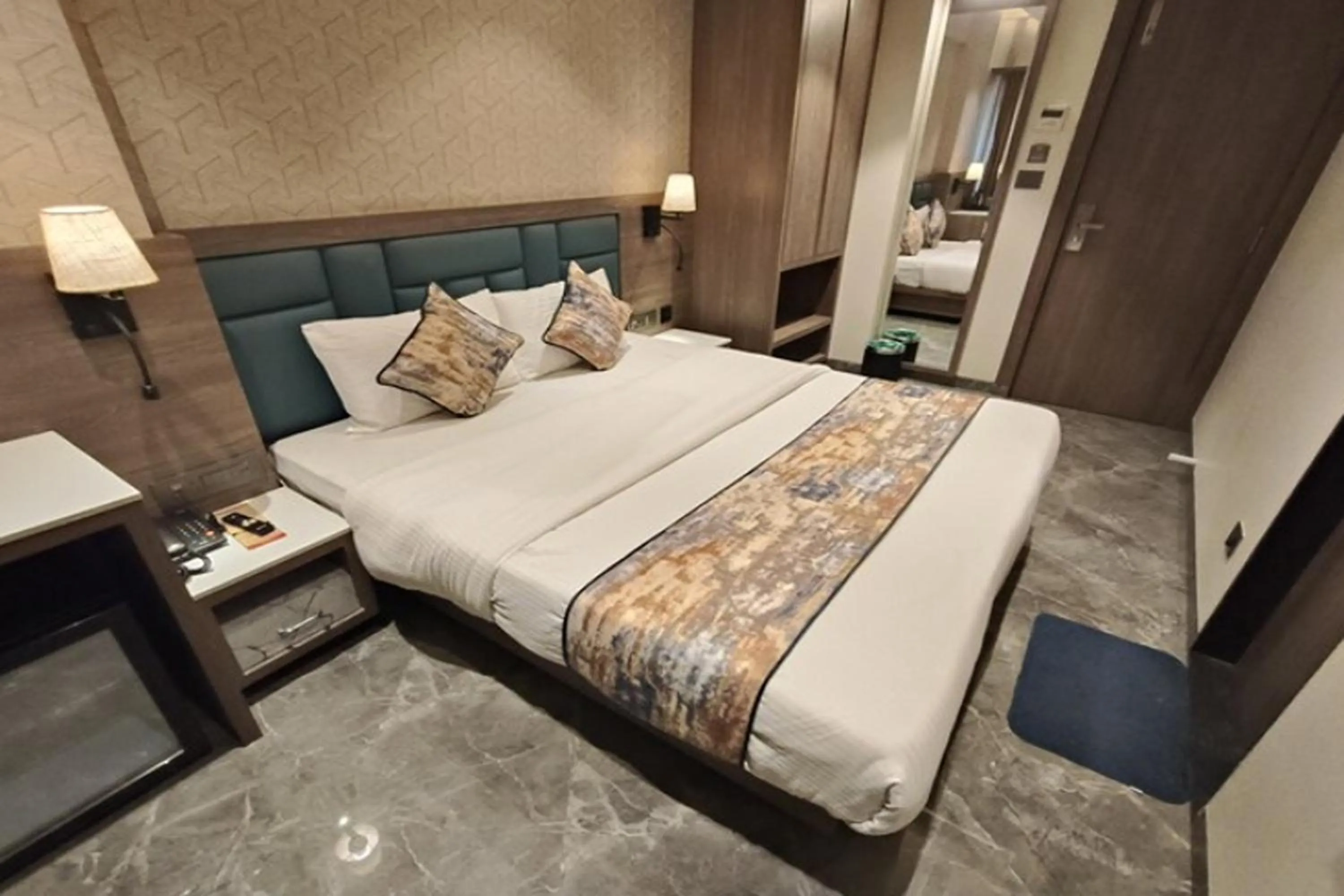 Bed in Dream Residency Hotels Pvt Ltd