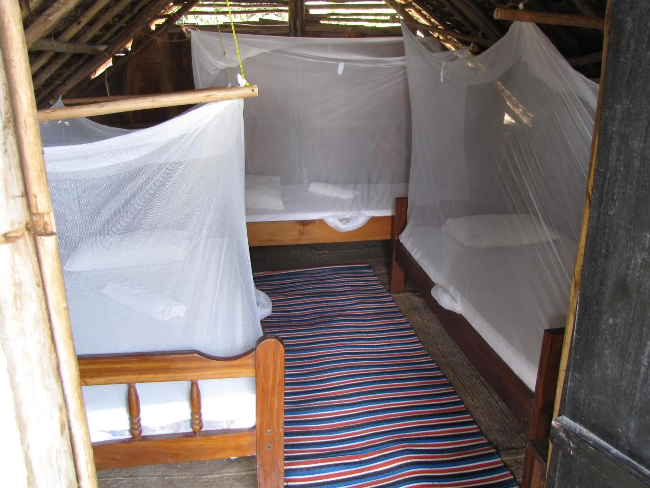 Photo of the whole room, Bed in Kipepeo Beach and Village