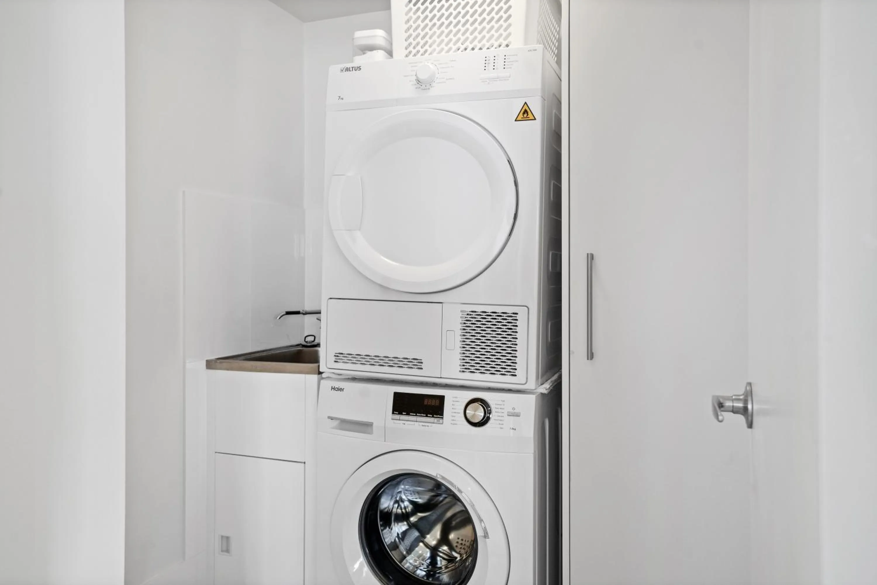 washing machine in Burgess @ Kings Beach Apartments