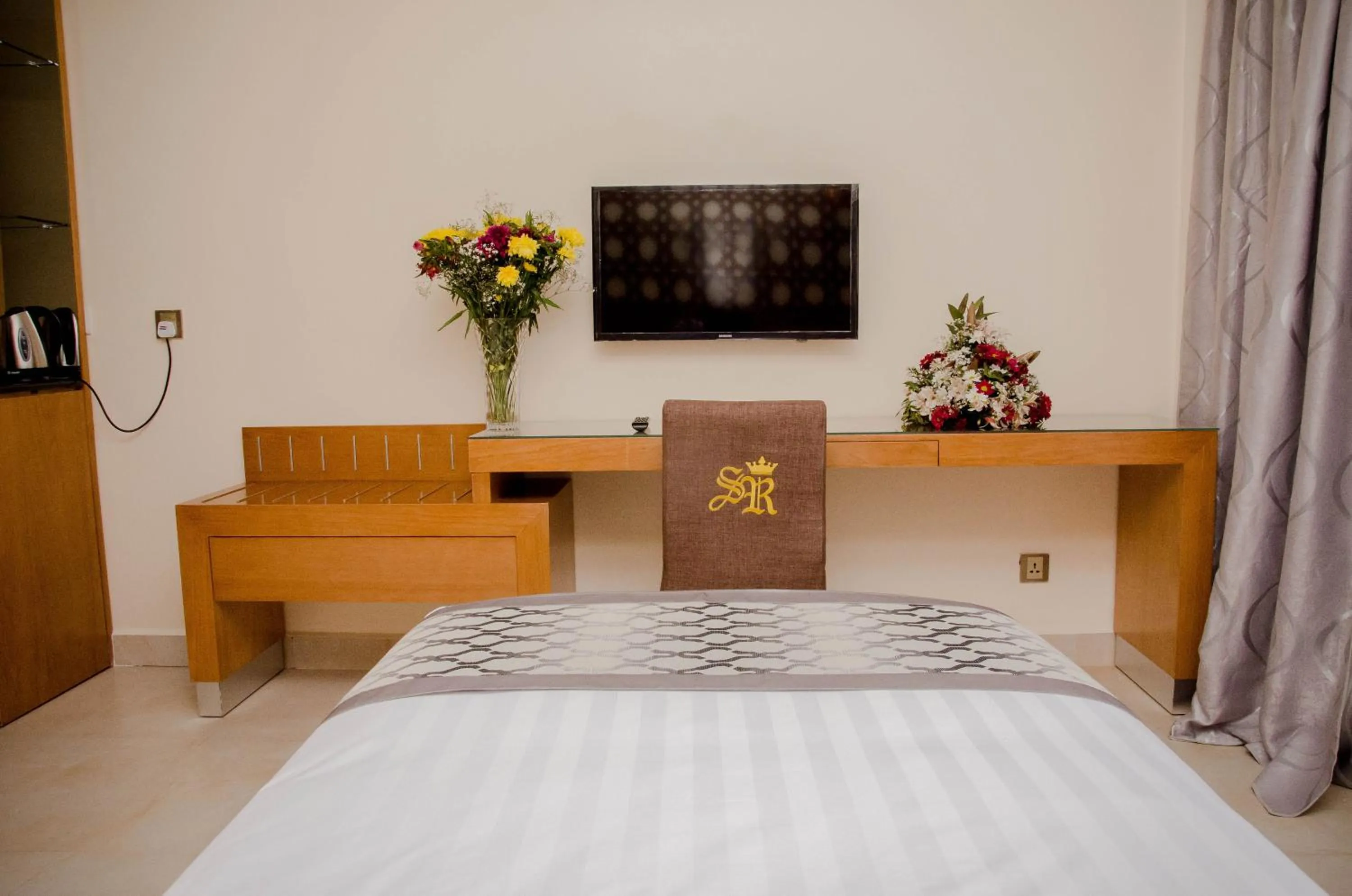 Bed in Saab Royale Hotel