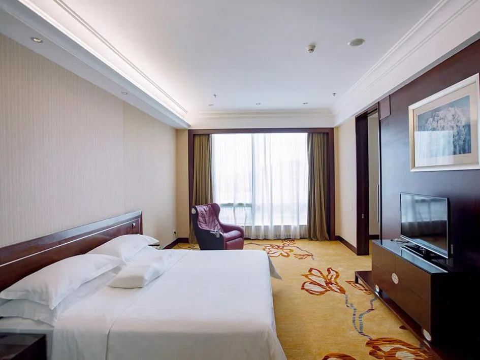 Bed in Vienna International Hotel Shenzhen Hua'nan City