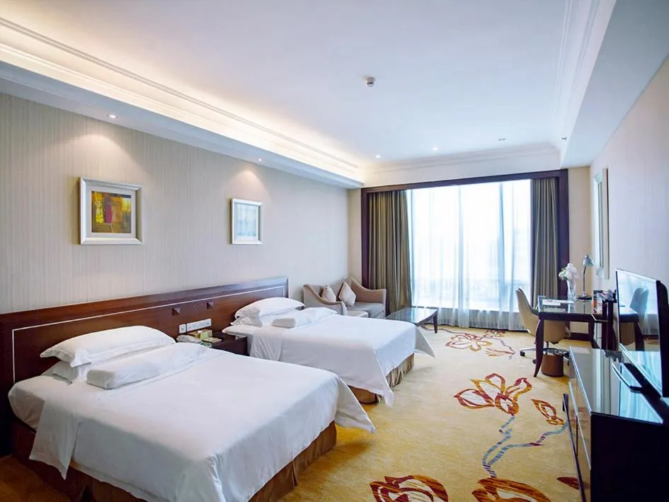 Bed in Vienna International Hotel Shenzhen Hua'nan City