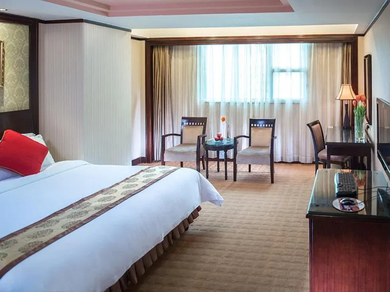 Bed in Vienna Hotel Shenzhen Fuhua Road