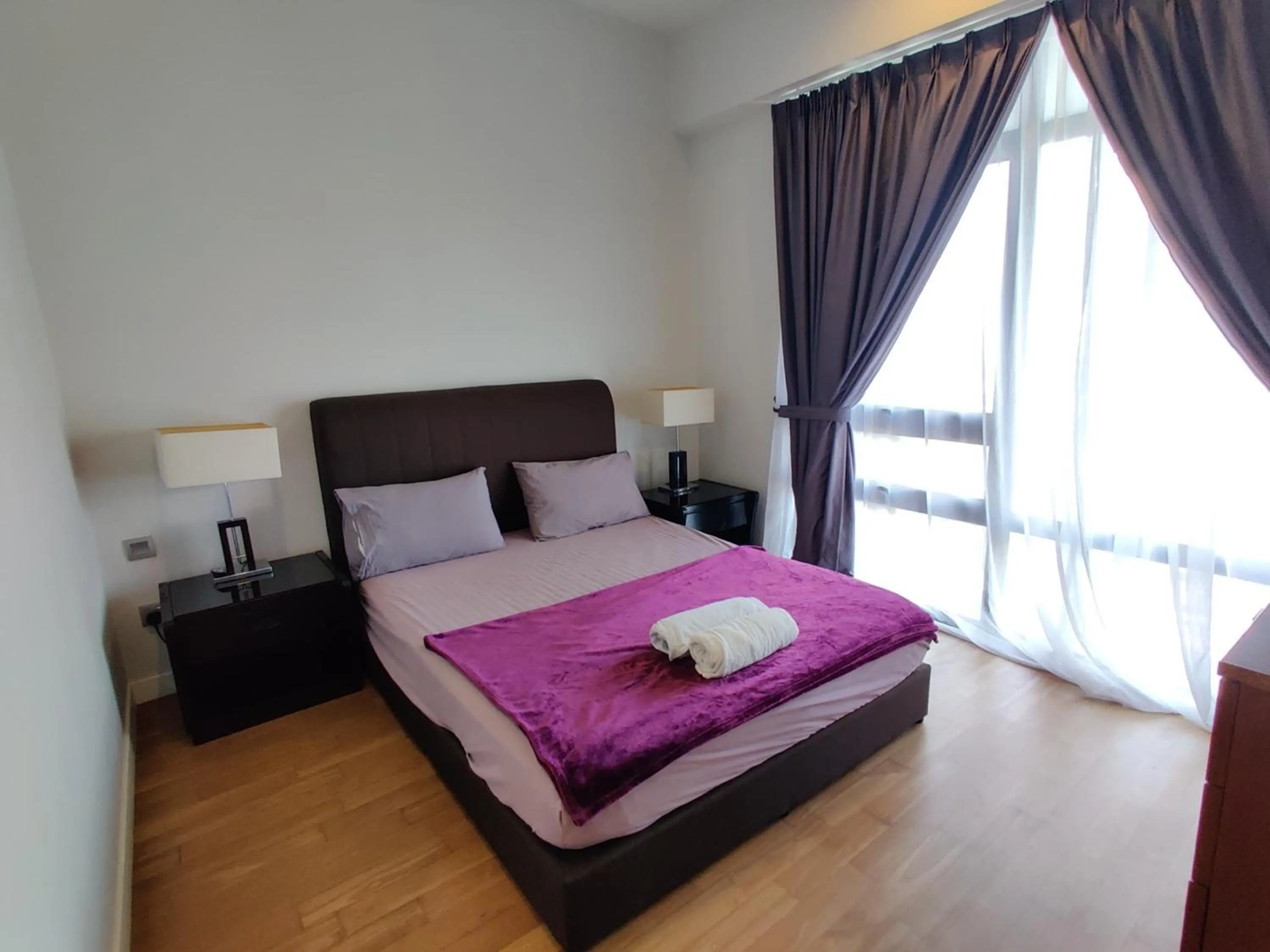 Bed in Leo Guesthouse at Anggun Residence Suite