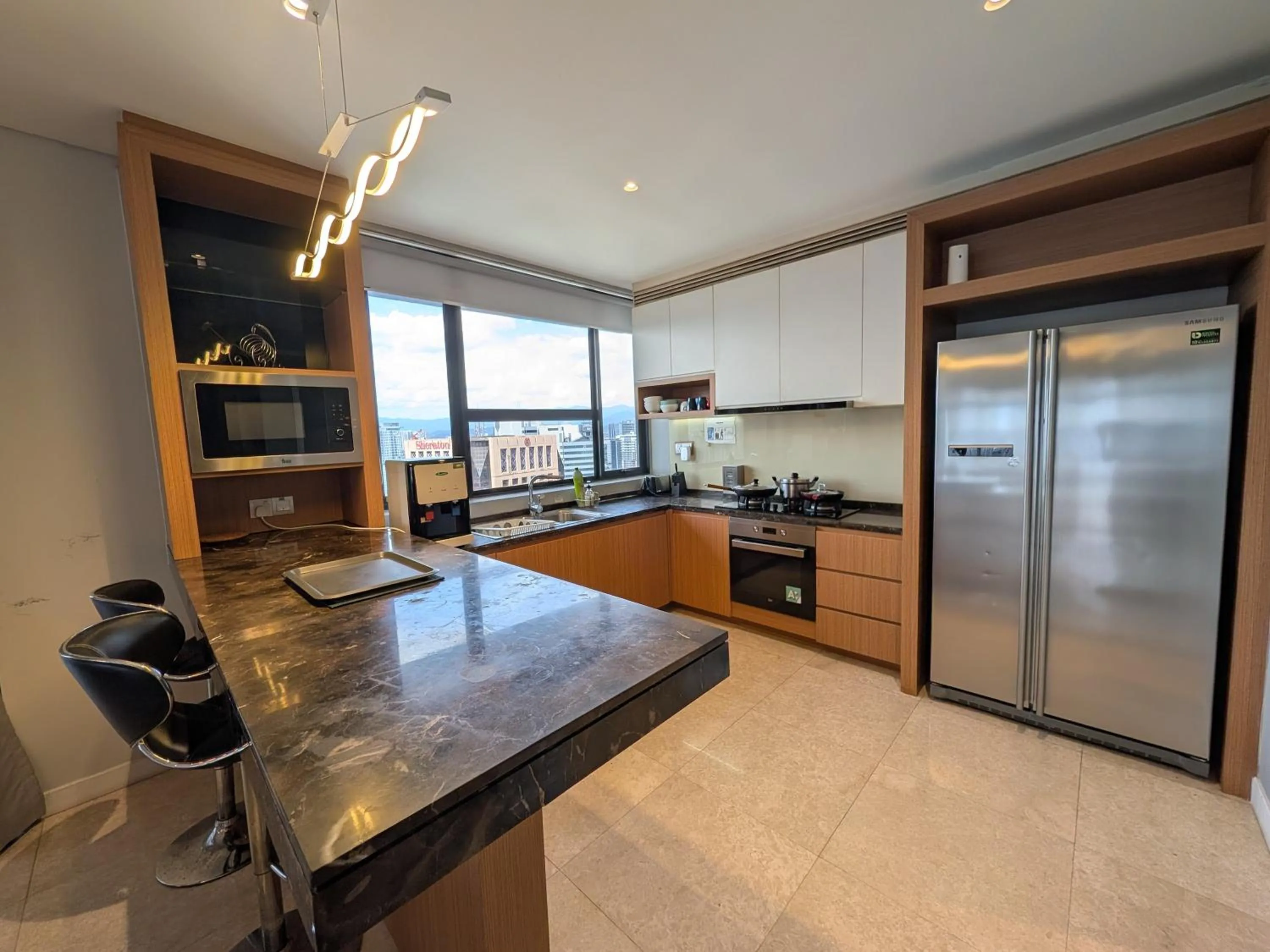 Kitchen or kitchenette in Leo Guesthouse at Anggun Residence Suite