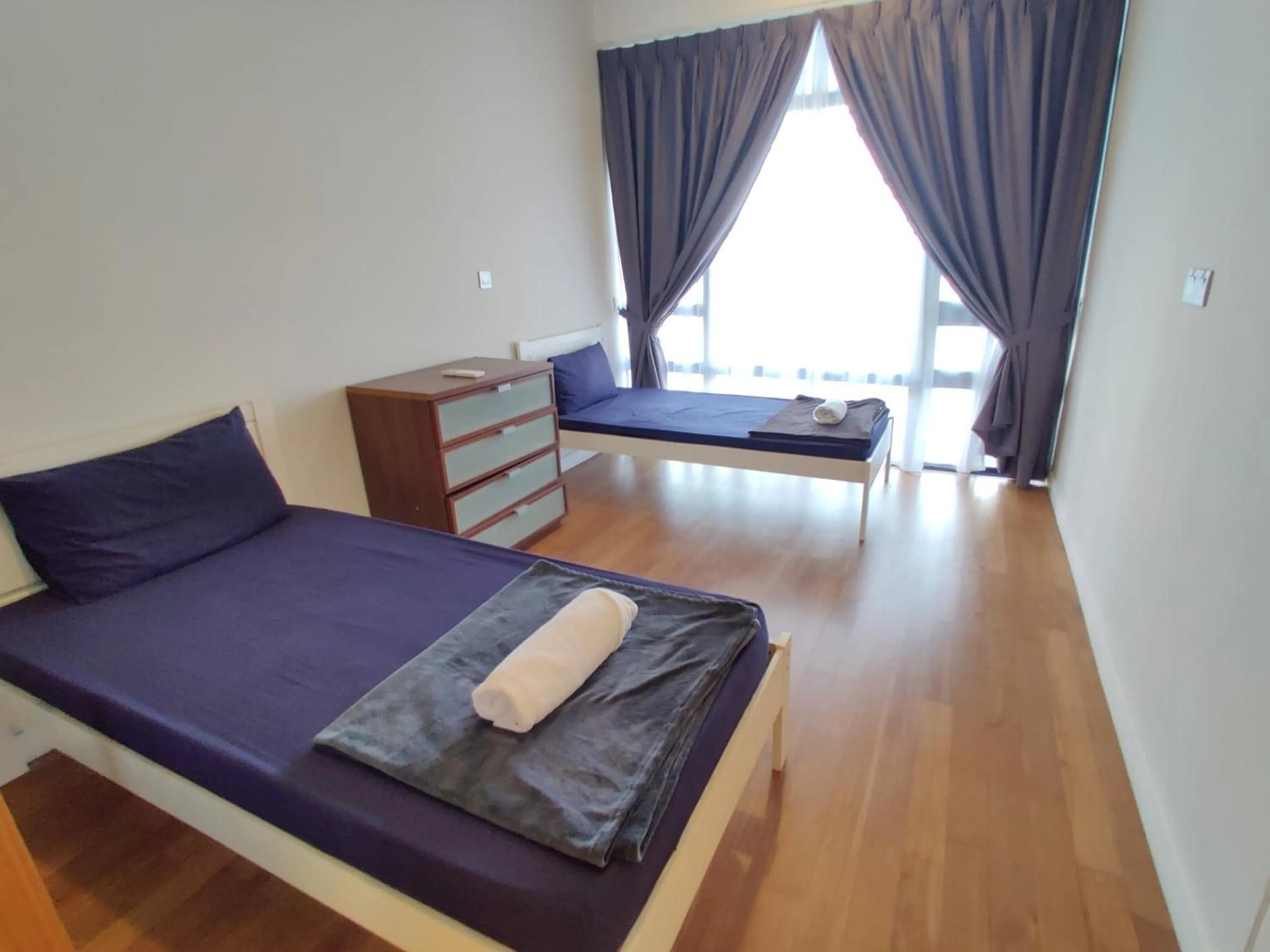 Bed in Leo Guesthouse at Anggun Residence Suite