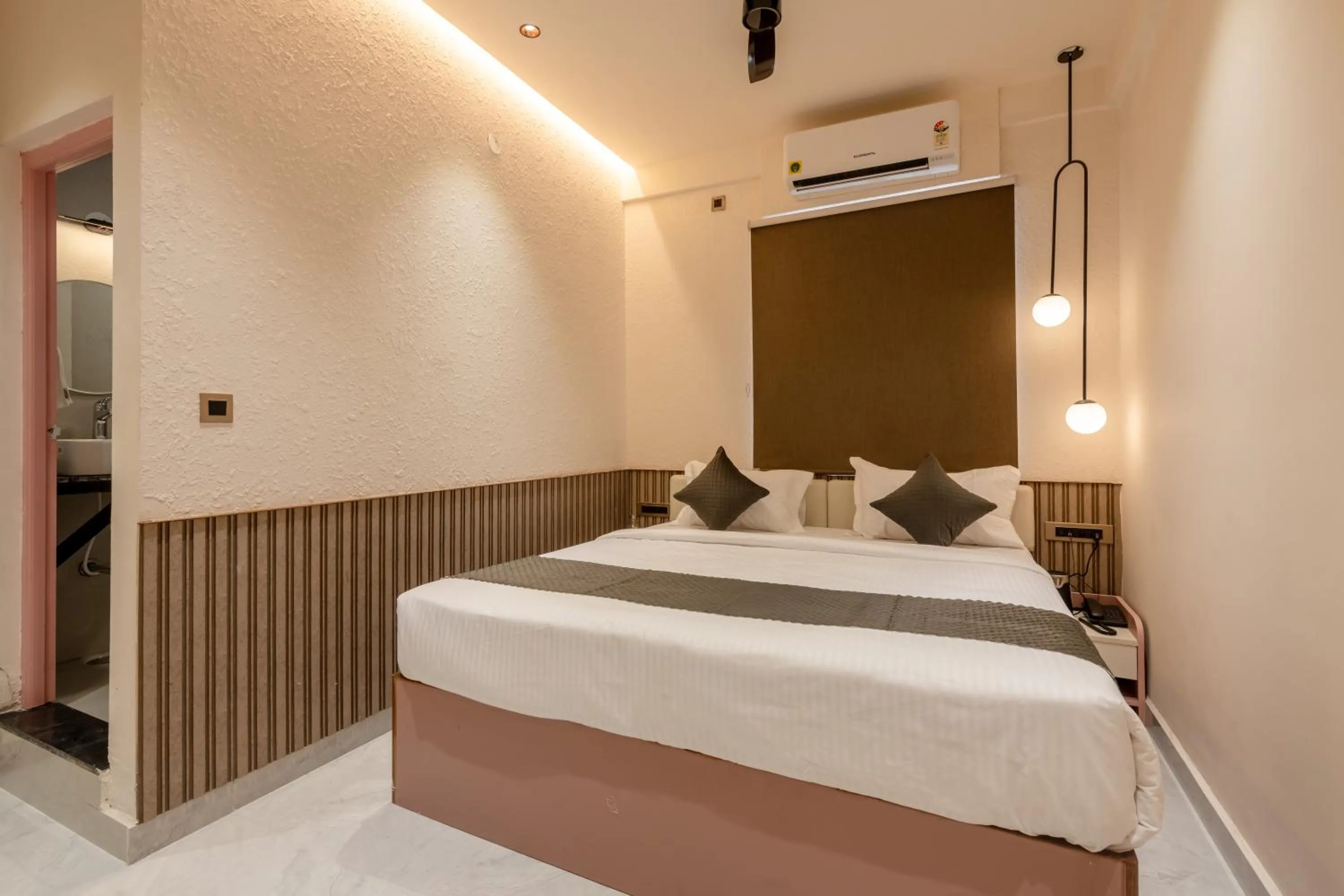 Bed in Legacy Inn, Mysore