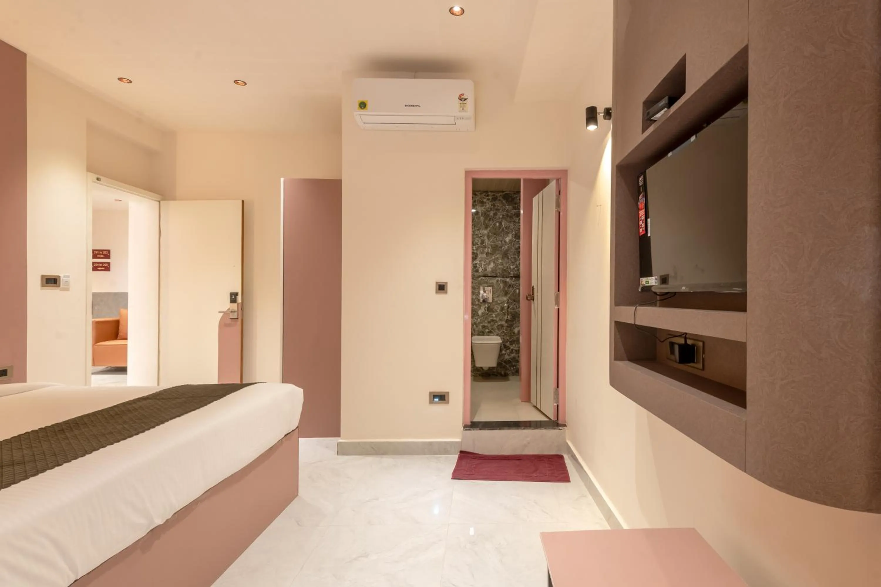 Photo of the whole room, Bed in Legacy Inn, Mysore