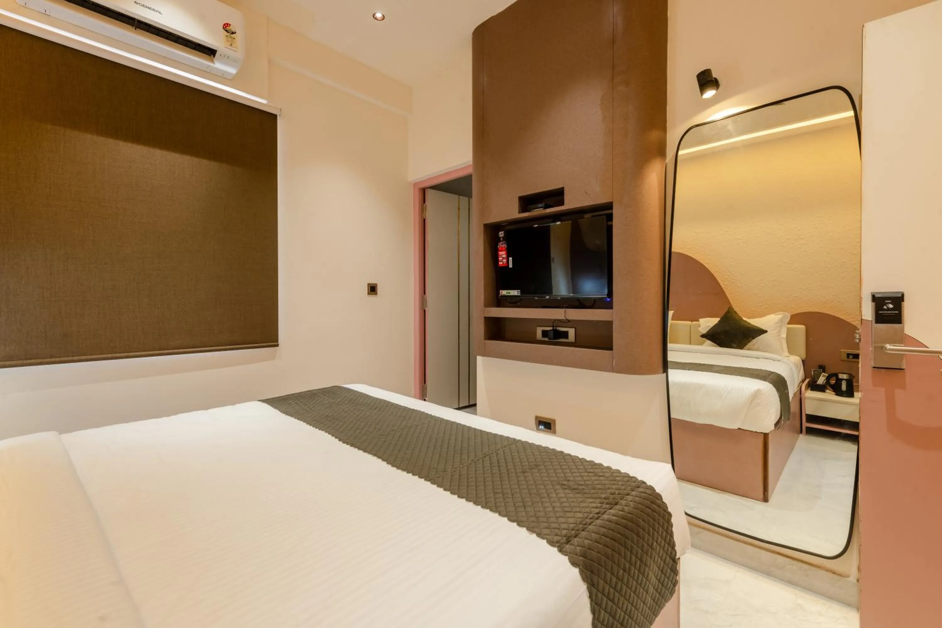 Bed in Legacy Inn, Mysore