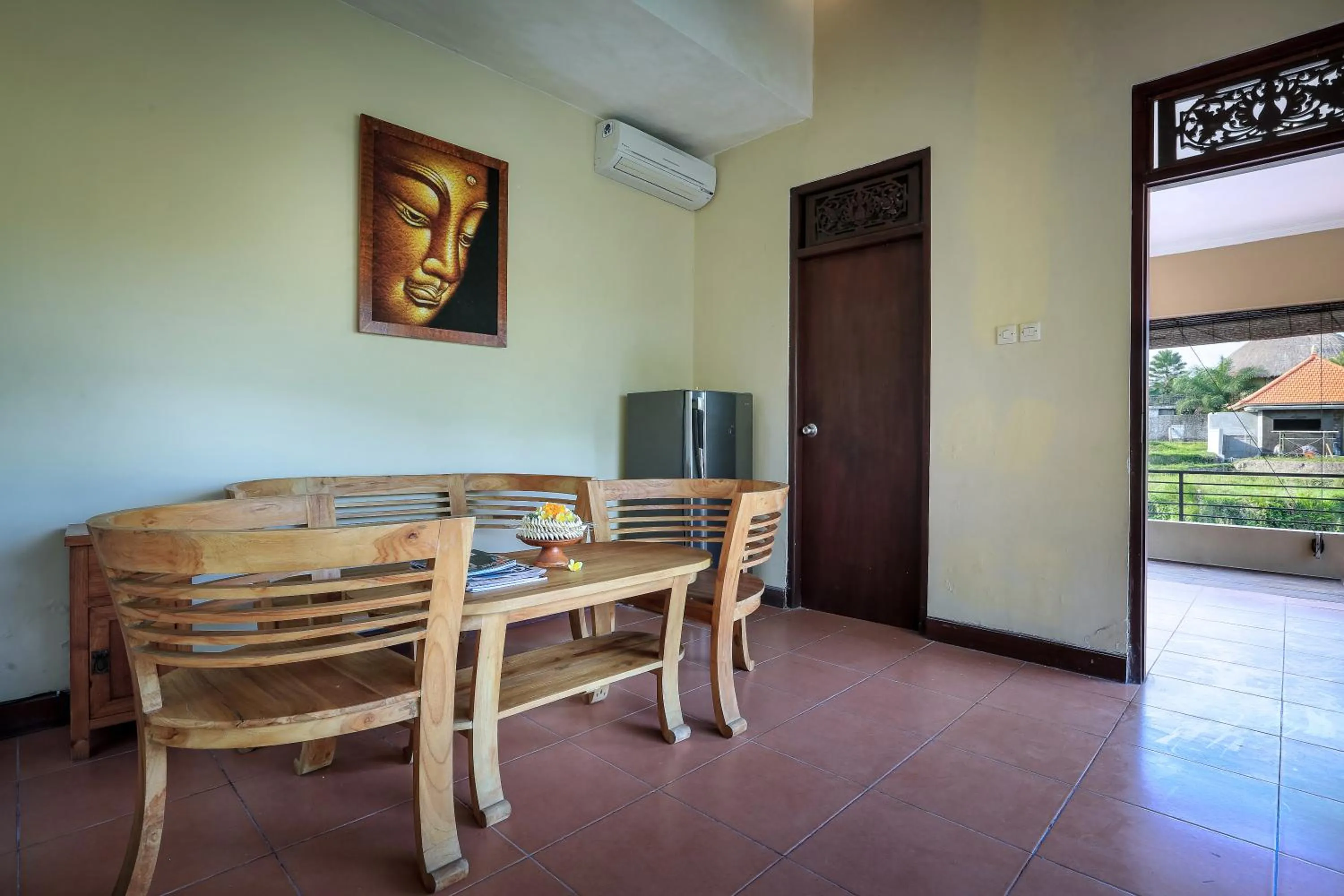 Communal lounge/ TV room in Nang Ade Villa by GenuineHost