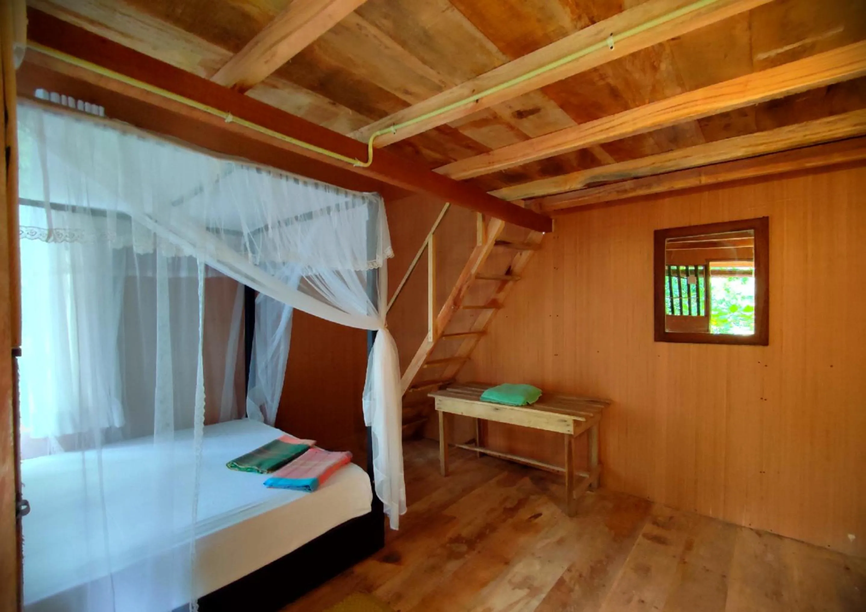 Bed in Sigiriya River Side Villa
