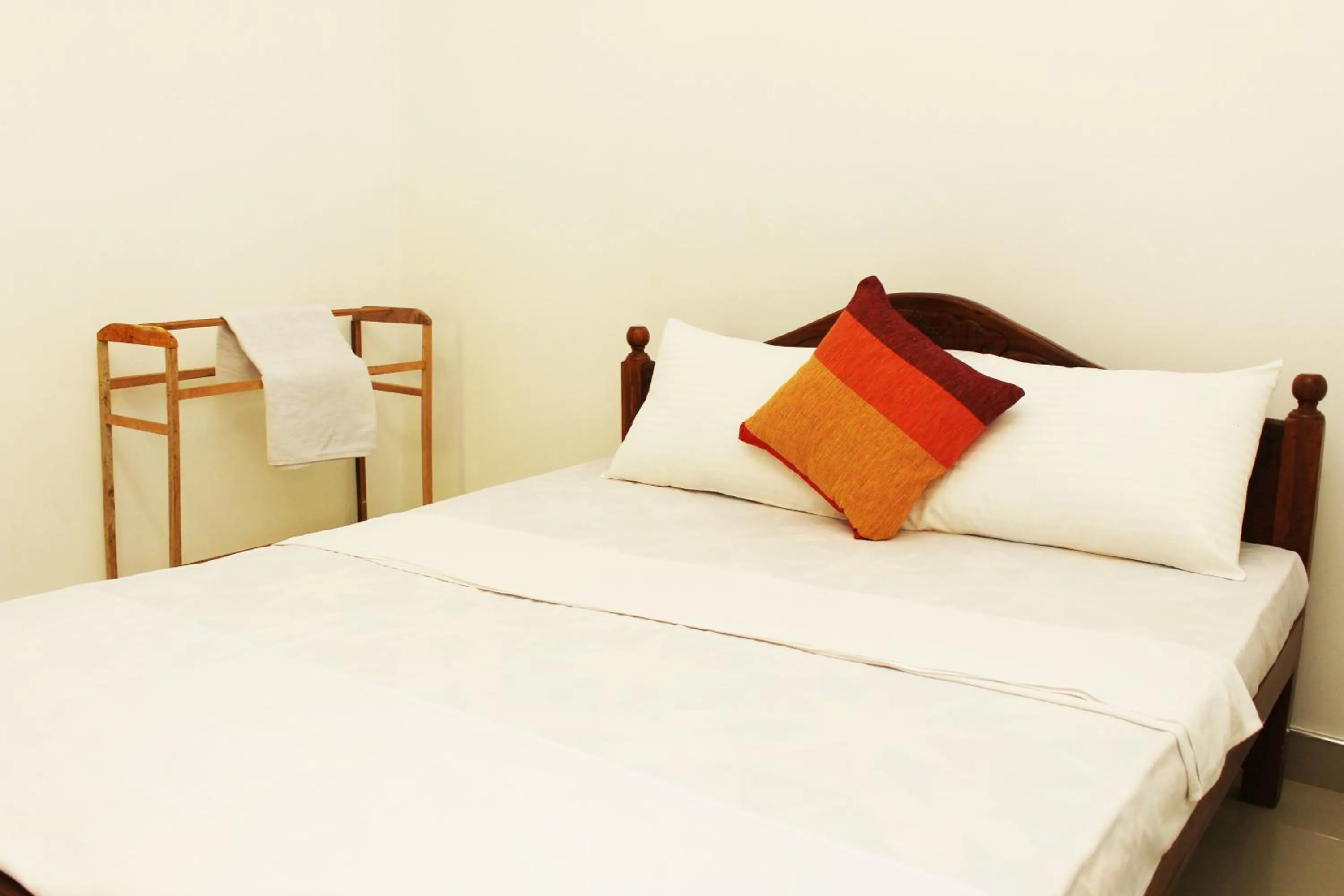 Bed in Sigiriya River Side Villa