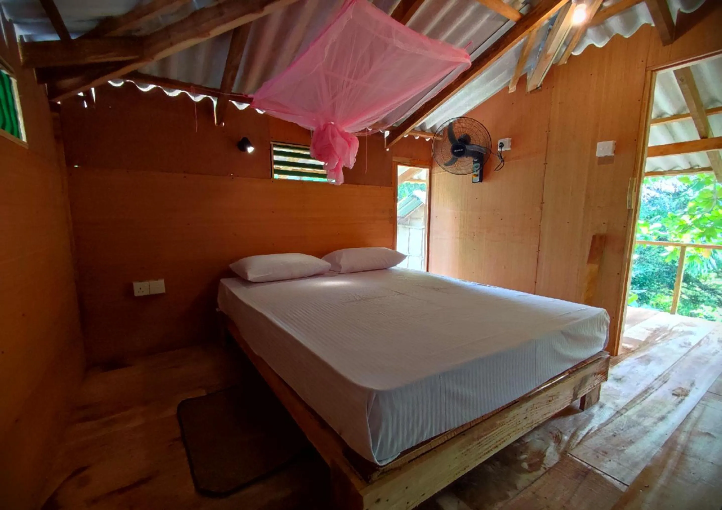 Bed in Sigiriya River Side Villa