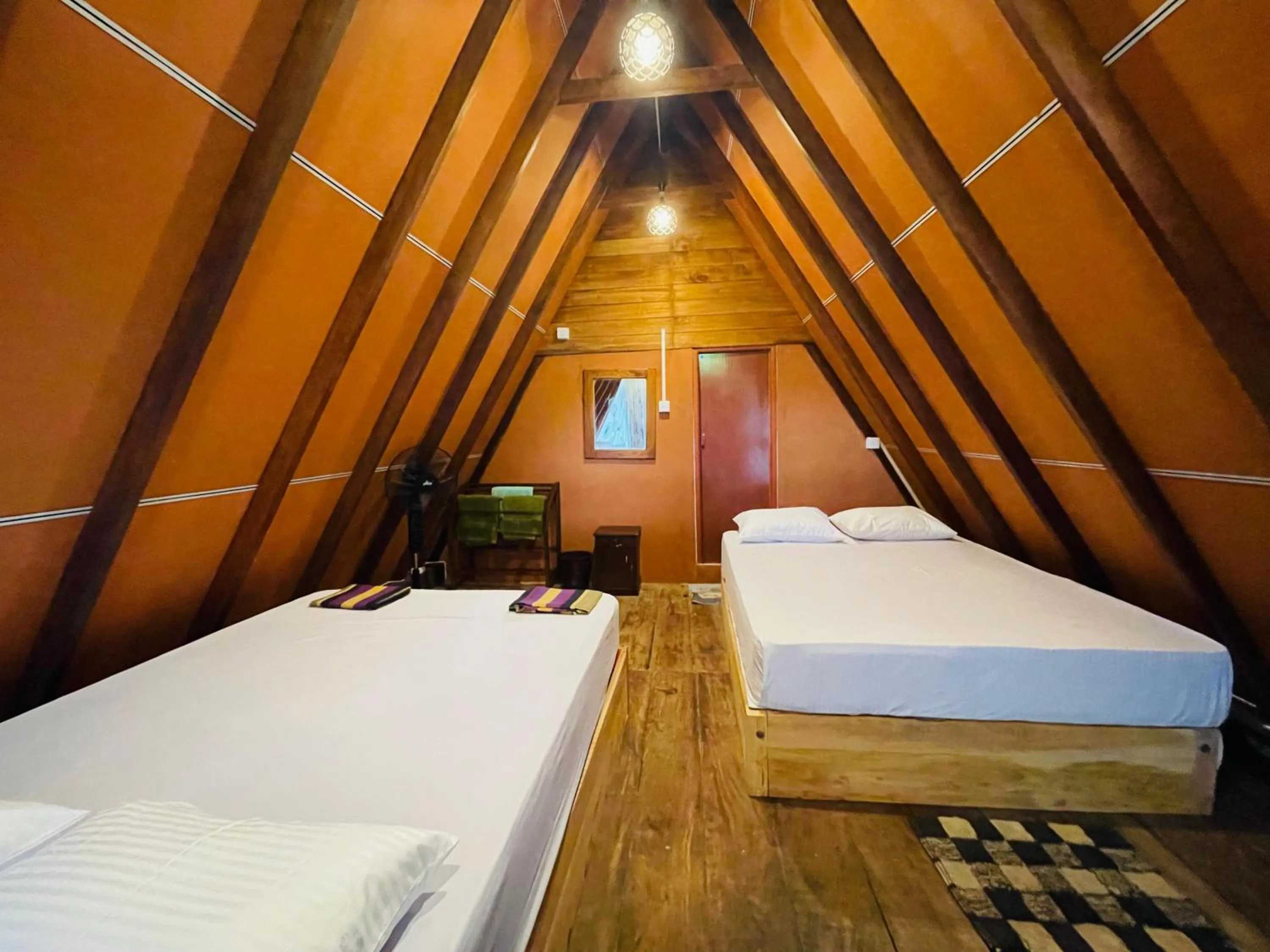 Bed in Sigiriya River Side Villa