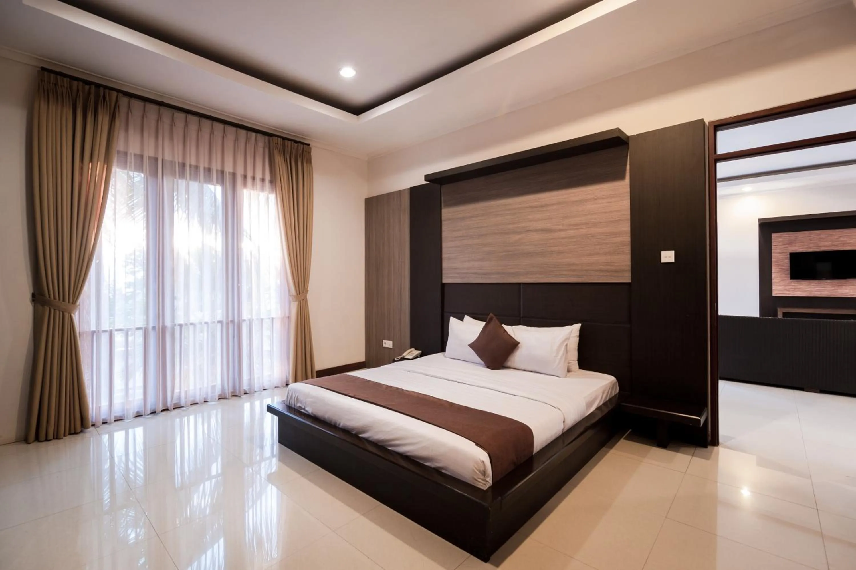 Bed in Surya Kencana Seaside Hotel