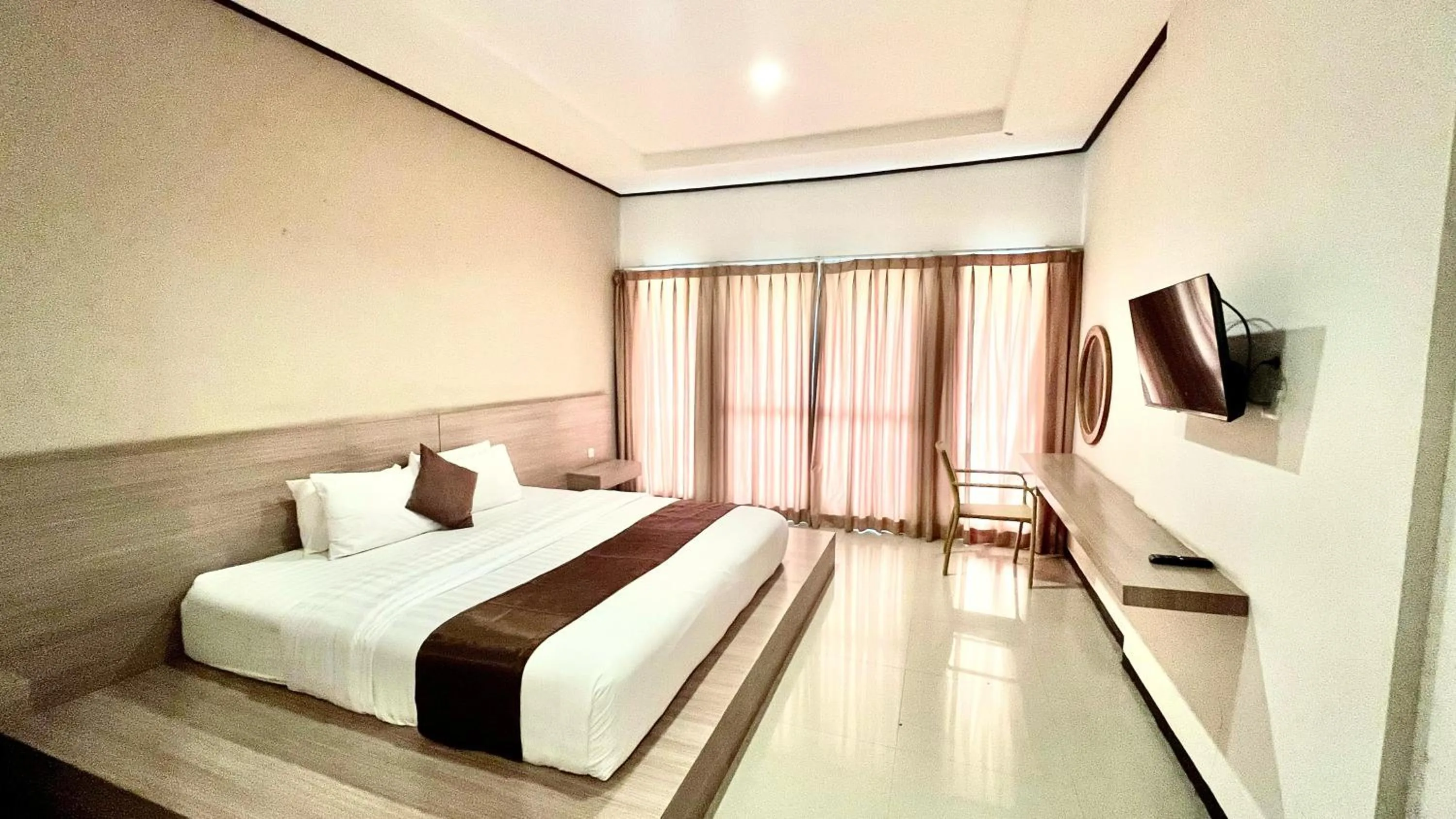 Bed in Surya Kencana Seaside Hotel