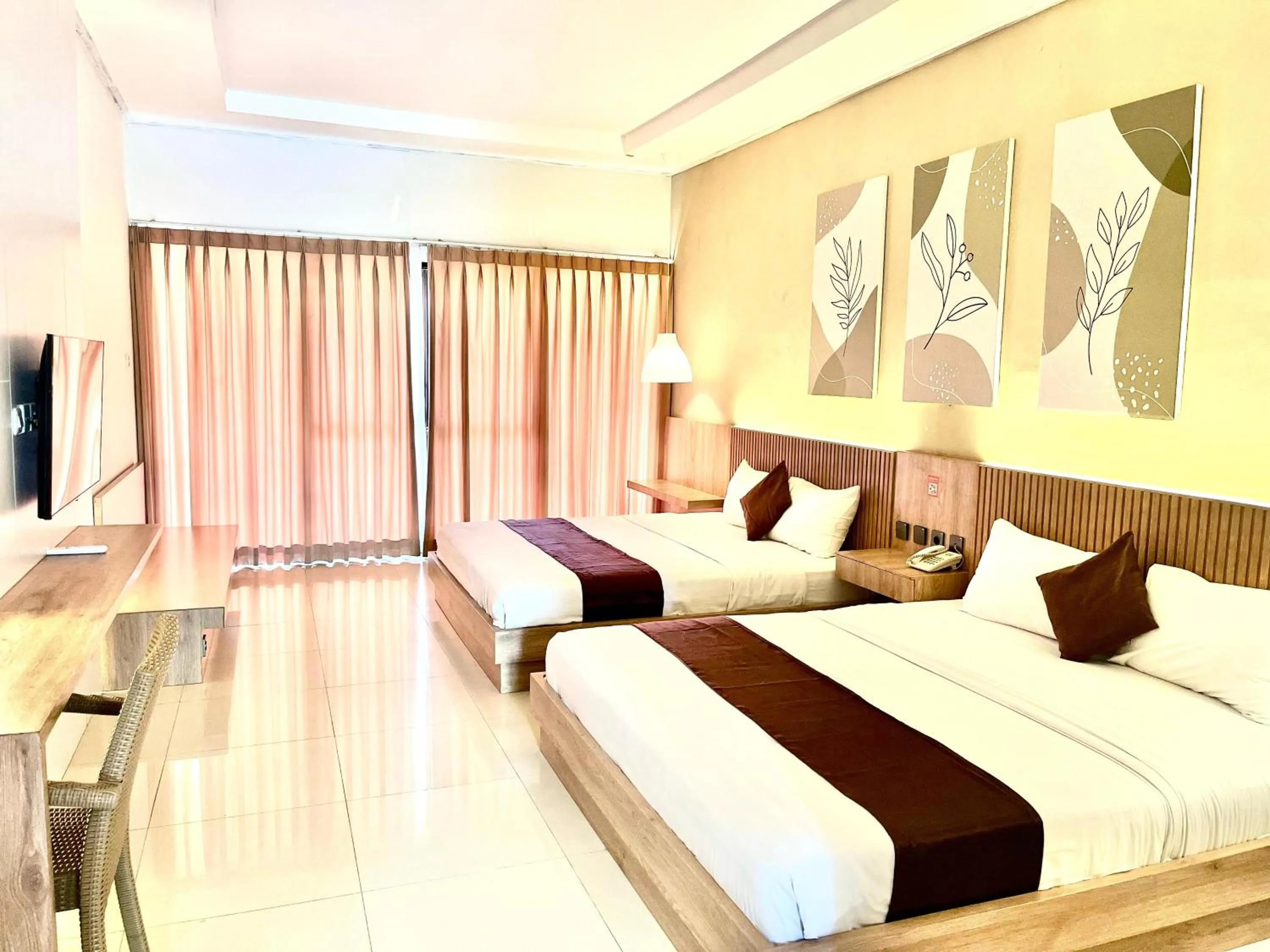 Bed in Surya Kencana Seaside Hotel