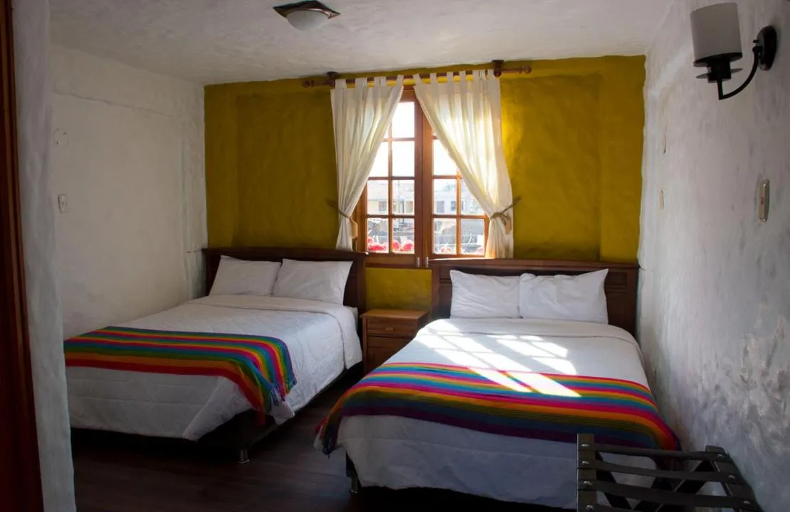 Bed in La Casa de Santiago Hotel