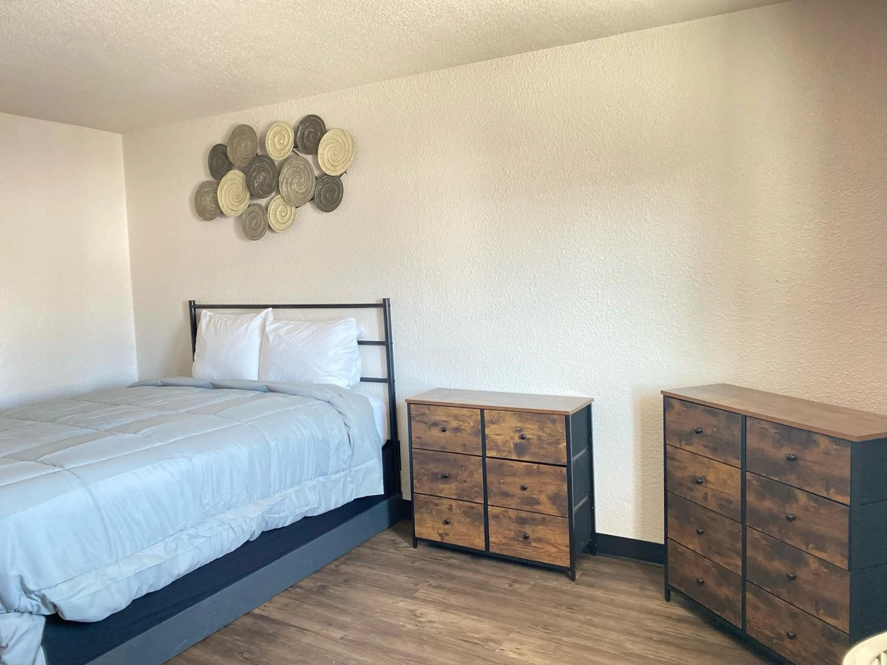 Bed in Baker City Motel & RV