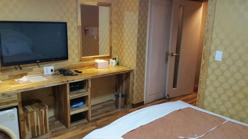 Bed in Green and Blue Hotel