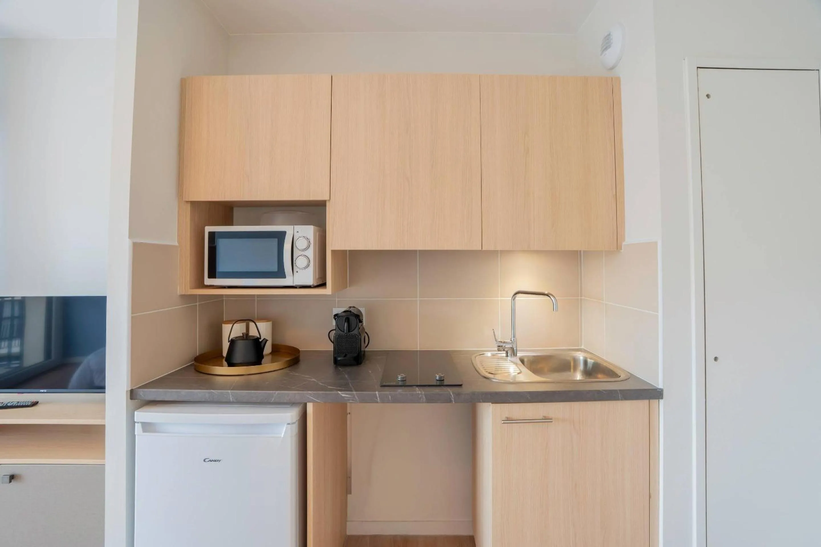 Kitchen or kitchenette in Quality Aparthotel Périgueux