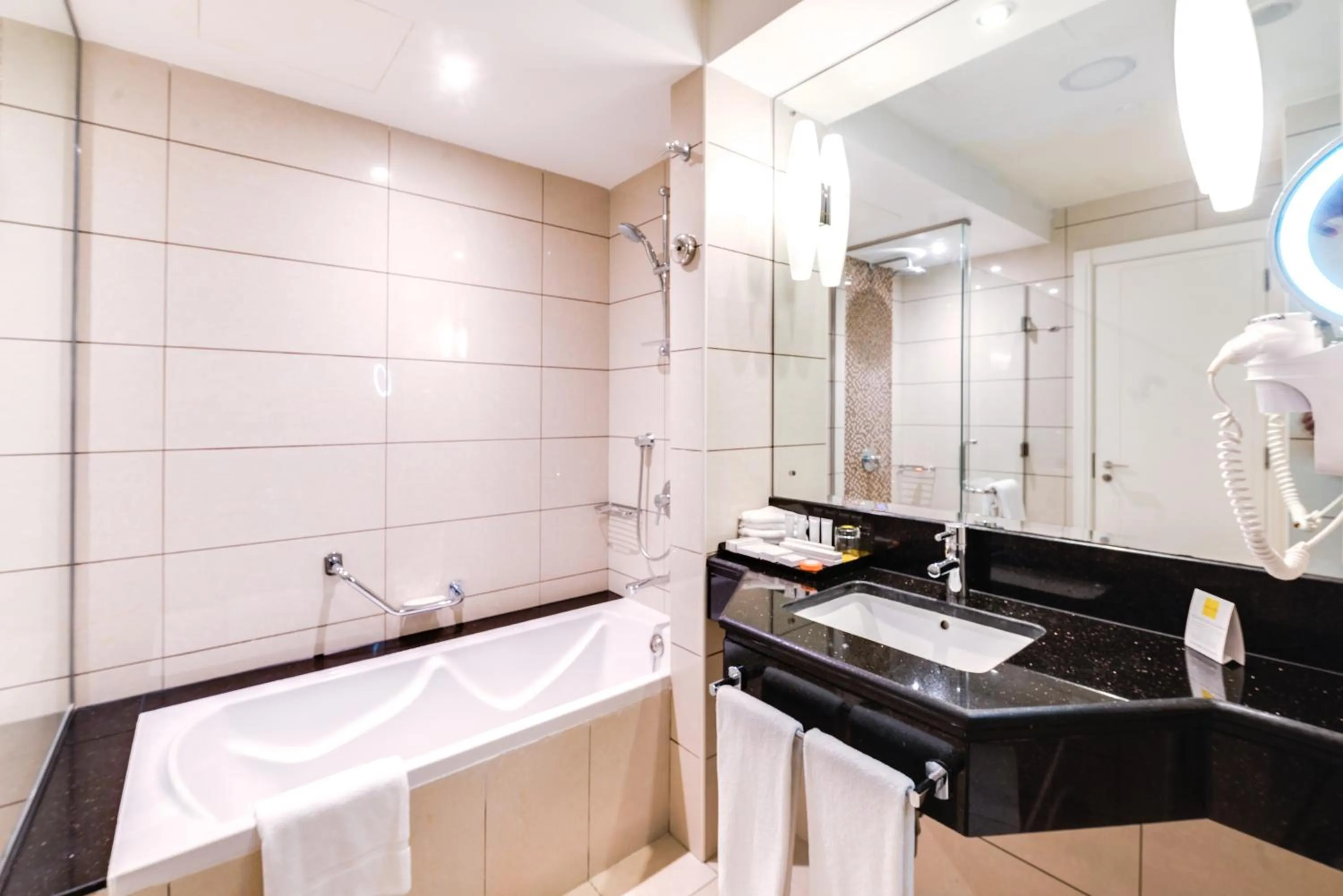 Bathroom in Golden Tulip Downtown Abu Dhabi