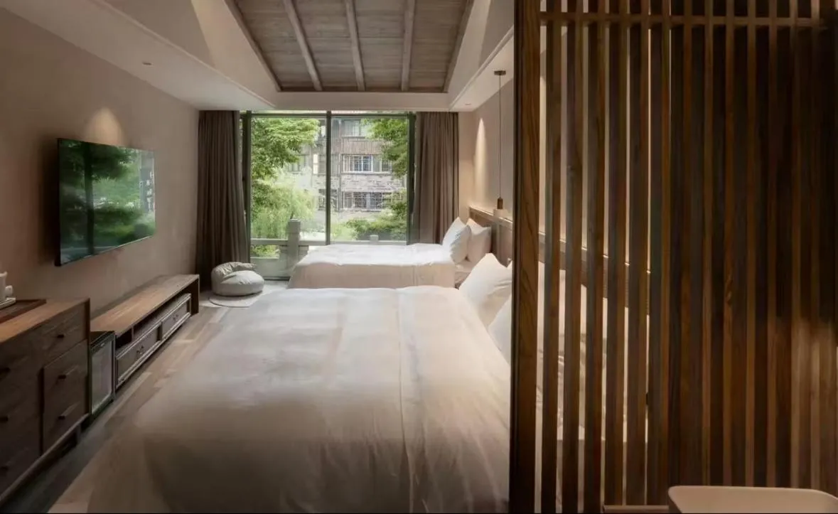 Bed in Shishe Spring Designer Homestay