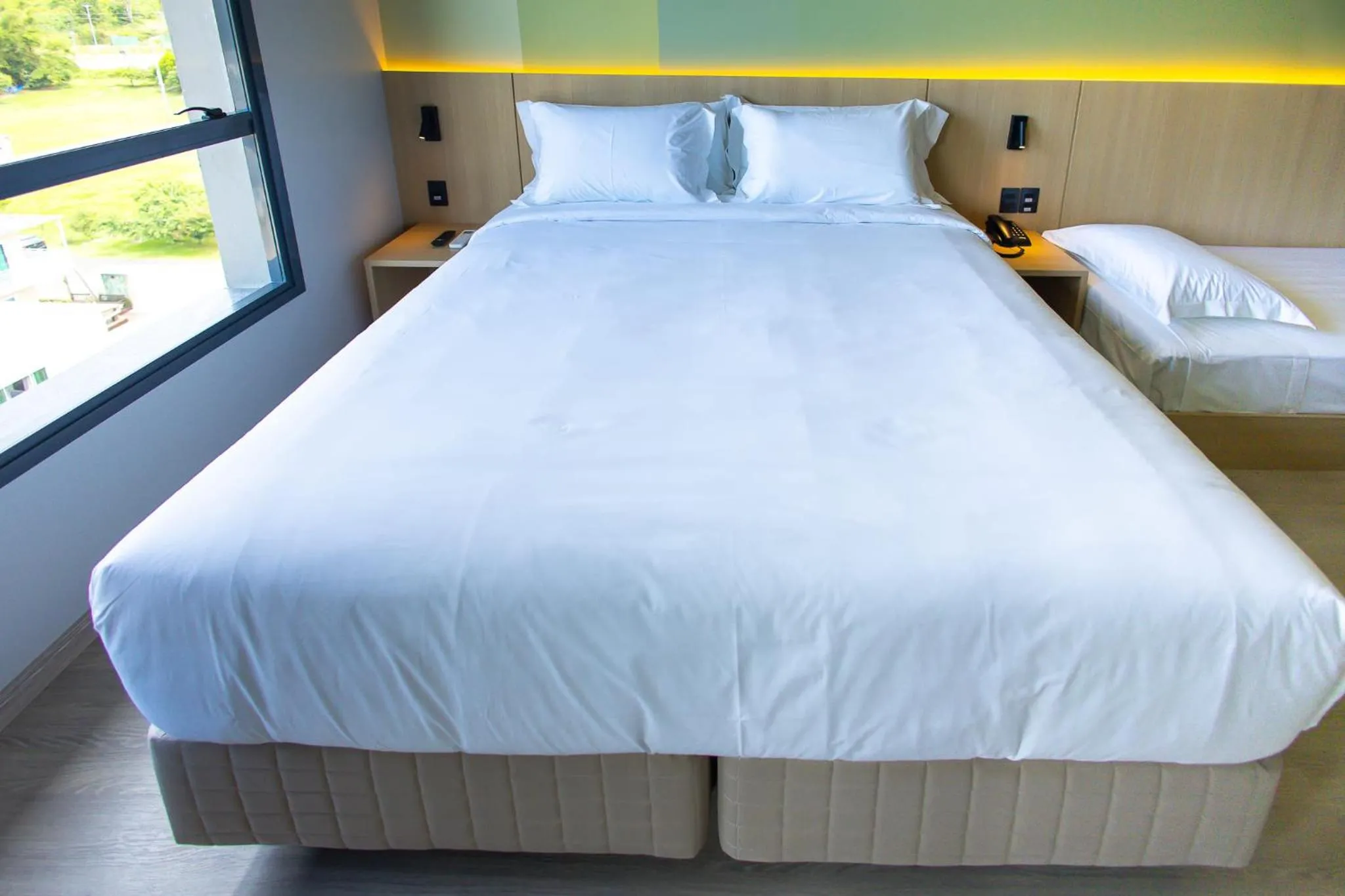Bed in Liwe Hotels