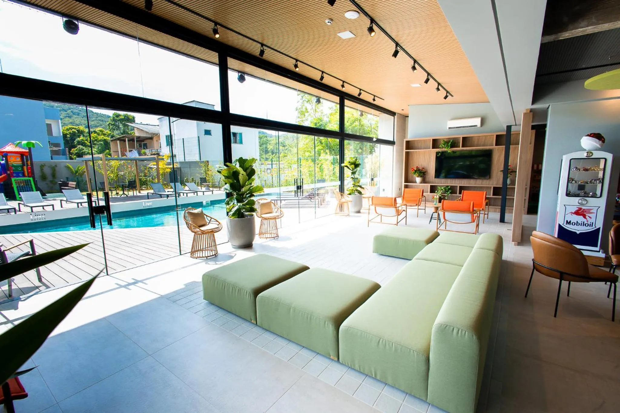 Communal lounge/ TV room in Liwe Hotels