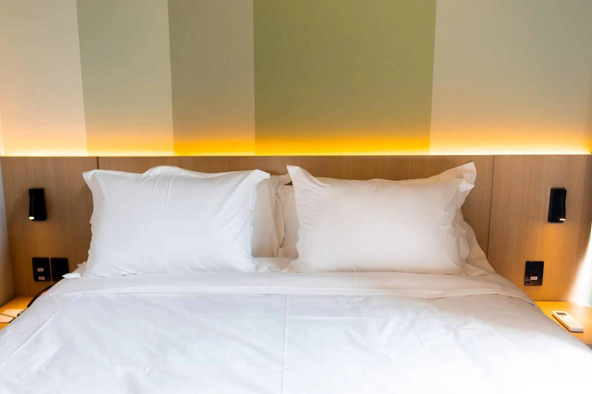 Bed in Liwe Hotels