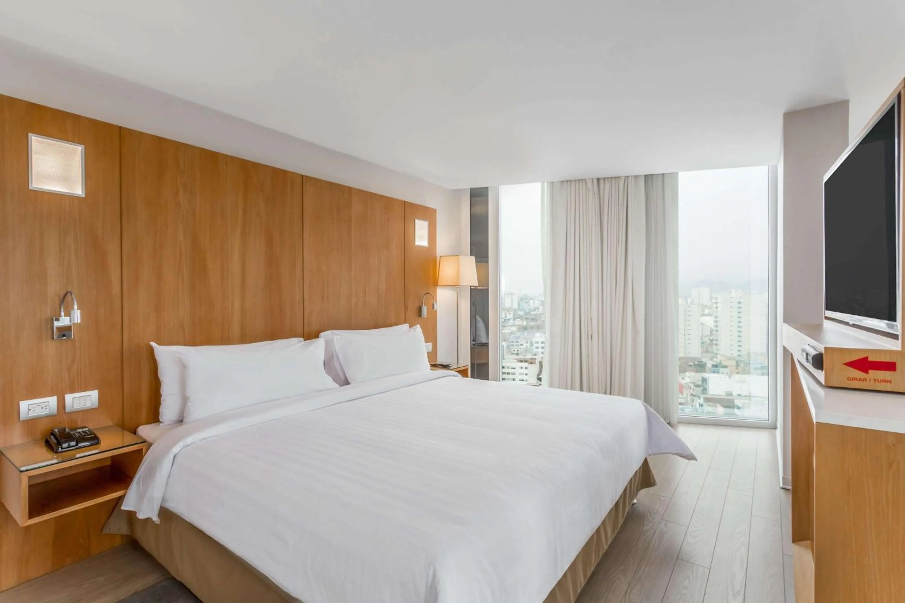Photo of the whole room, Bed in Ramada Encore by Wyndham Lima San Isidro