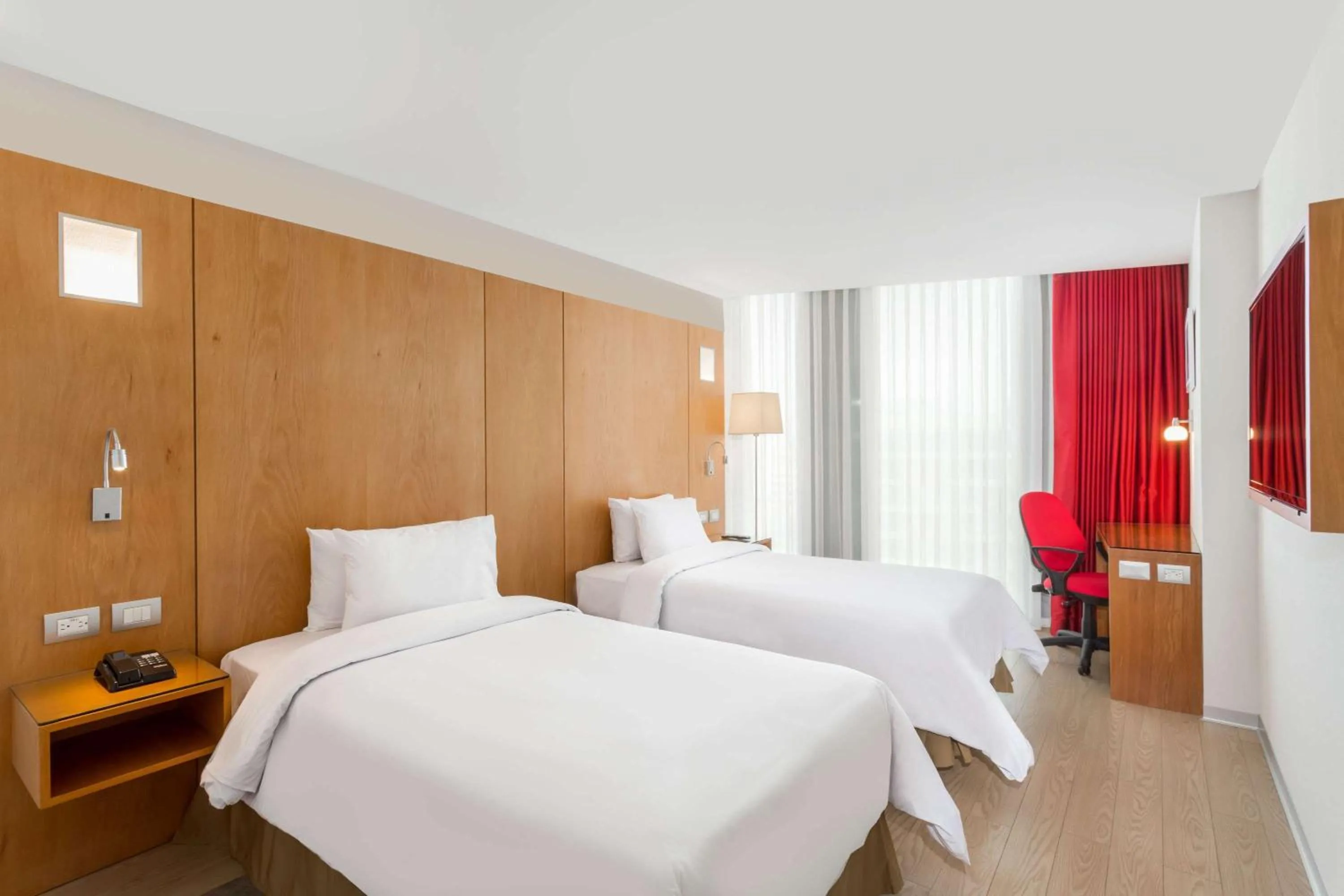 Photo of the whole room, Bed in Ramada Encore by Wyndham Lima San Isidro
