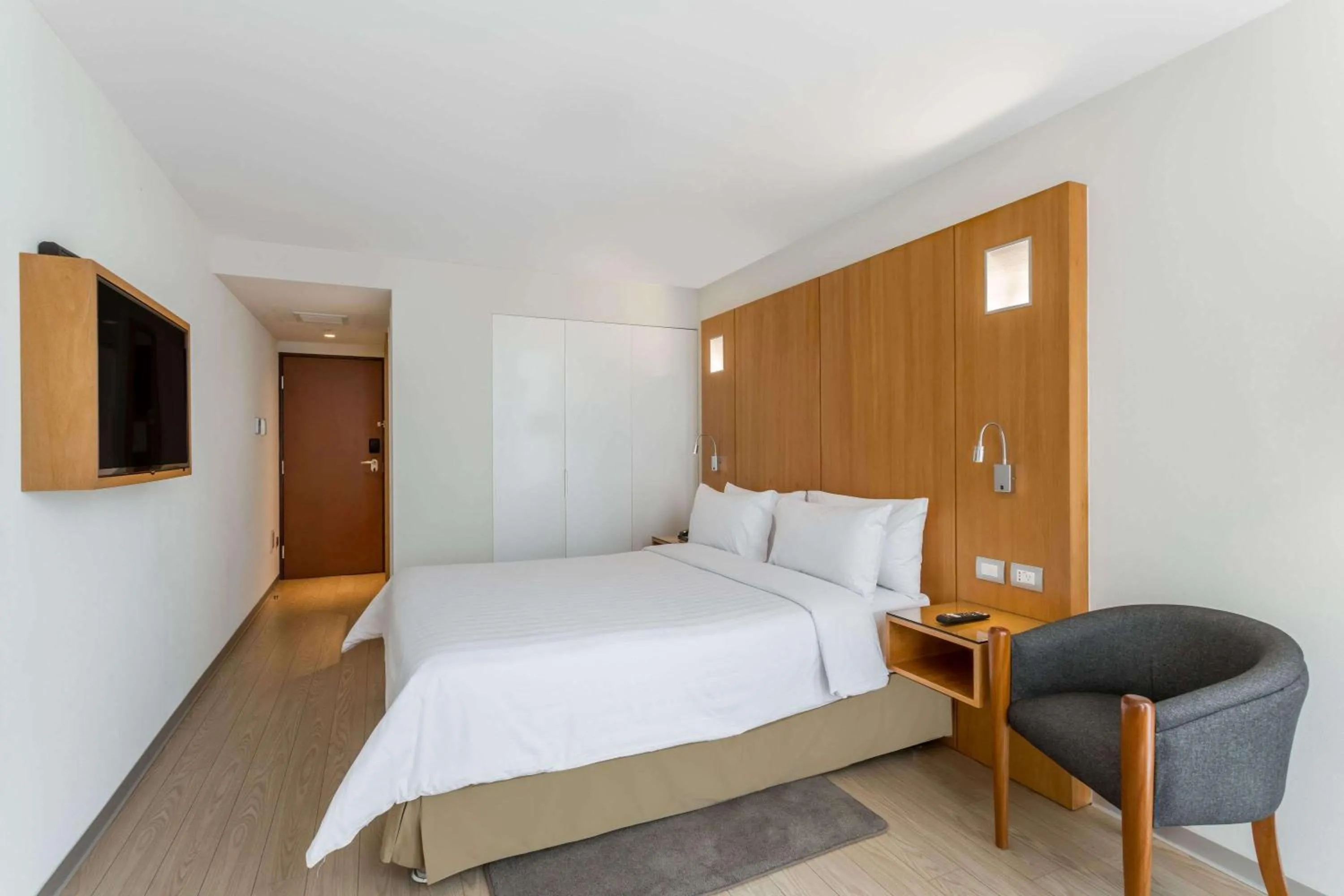 Photo of the whole room, Bed in Ramada Encore by Wyndham Lima San Isidro