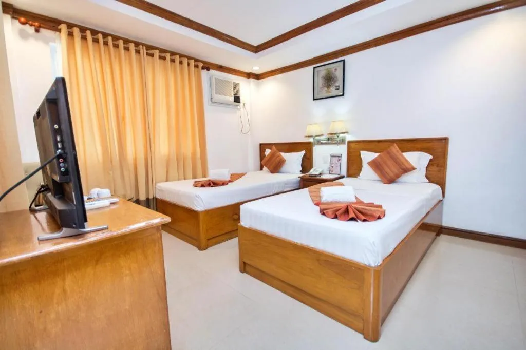 Bed in Grand Boracay Resort