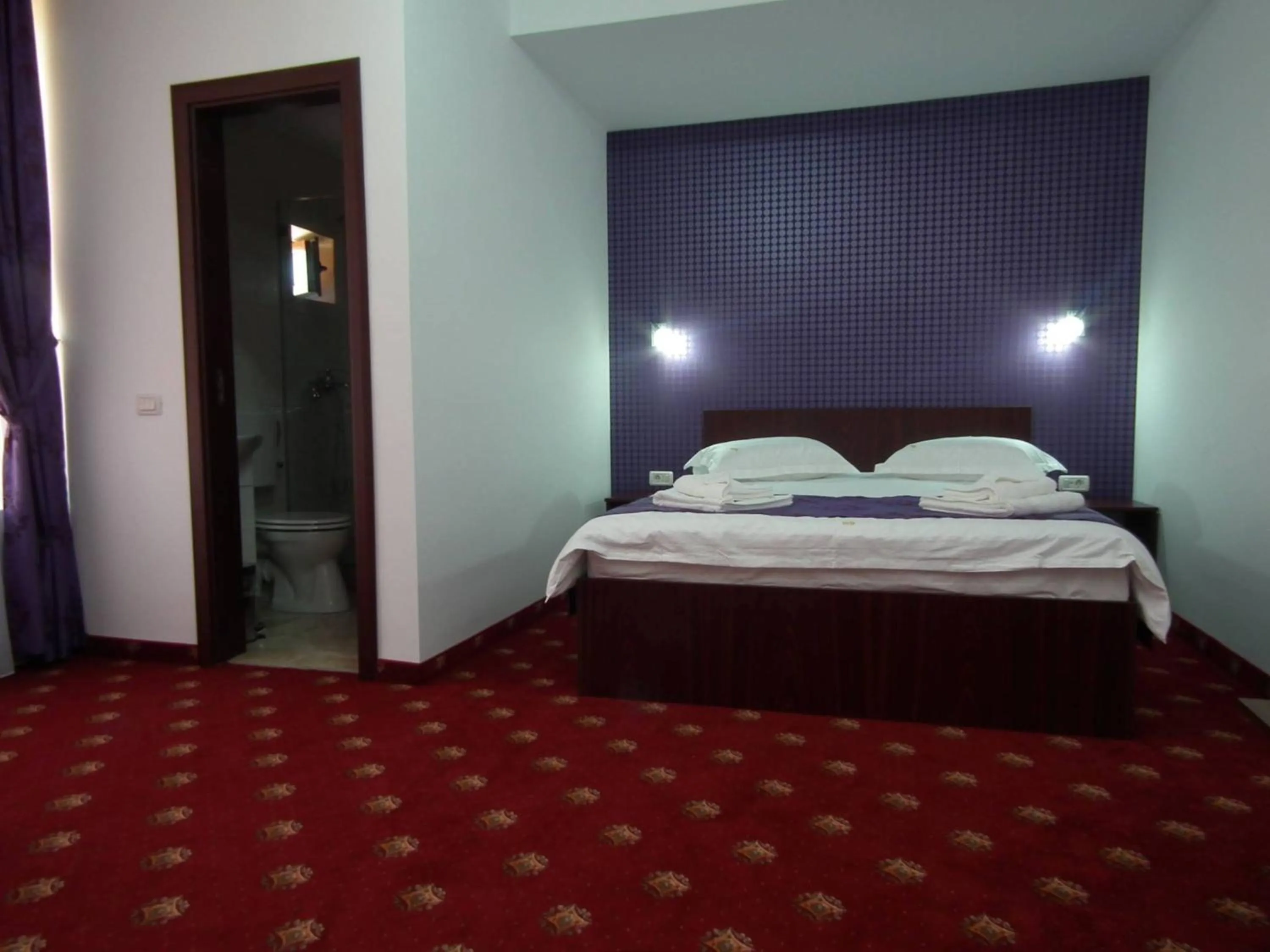 Bed in Vila Queen Mary