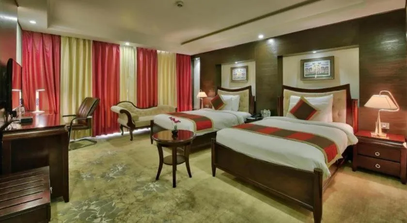 Bed in POLO Inn & Suites