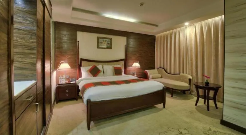 Bed in POLO Inn & Suites