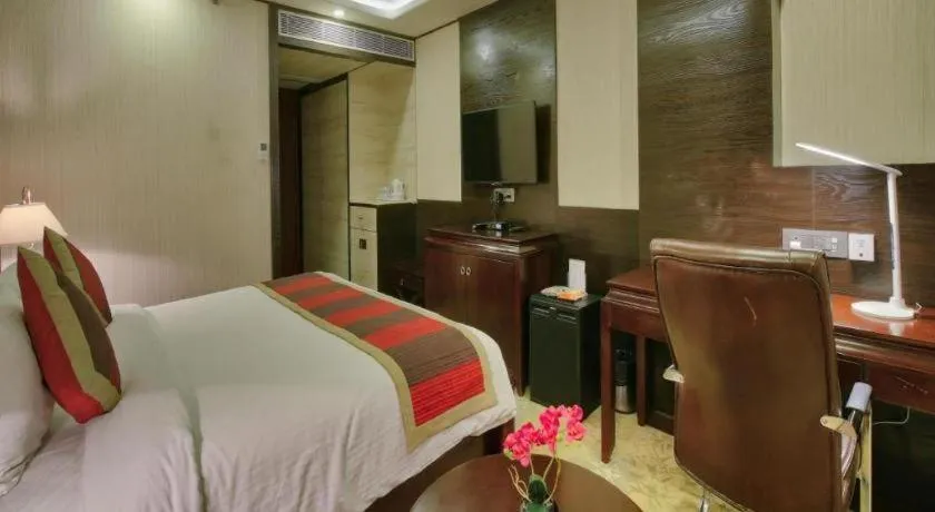 Bed in POLO Inn & Suites