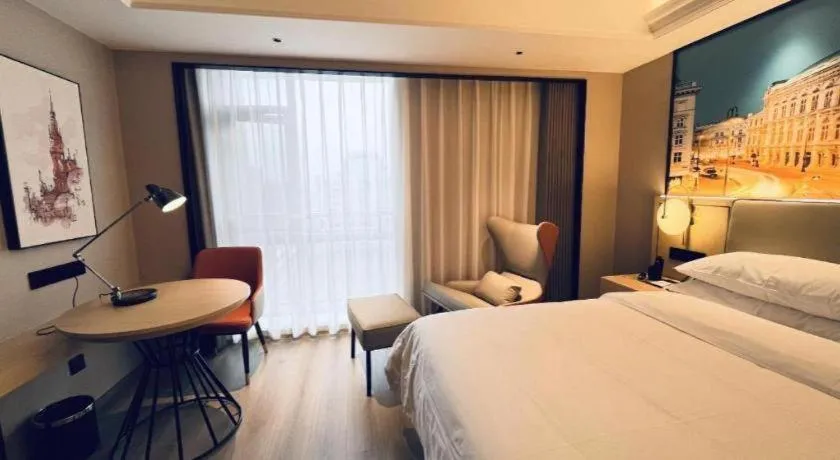 Bed in Vienna International Hotel Wuhan Huanghelou Pengliuyang Metro Station