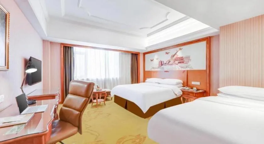 Bed in Vienna International Hotel Wuhan Huanghelou Pengliuyang Metro Station