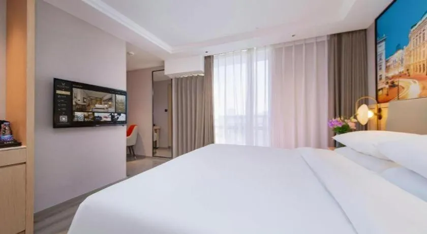 Bed in Vienna International Hotel Wuhan Huanghelou Pengliuyang Metro Station