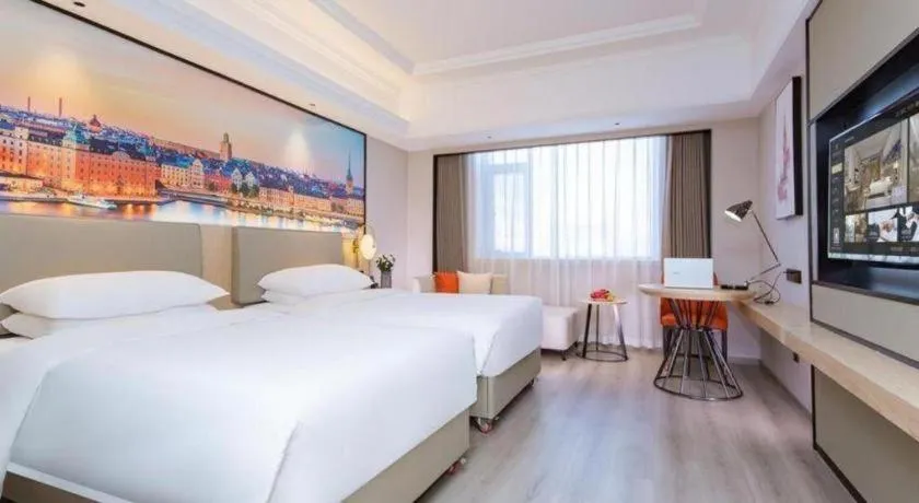 Bed in Vienna International Hotel Wuhan Huanghelou Pengliuyang Metro Station